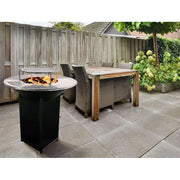 Brasero Barbecue REVO Bilbao en Acier 100 cm – Plaque de Cuisson Circulaire et Rangement à Bois Intégré